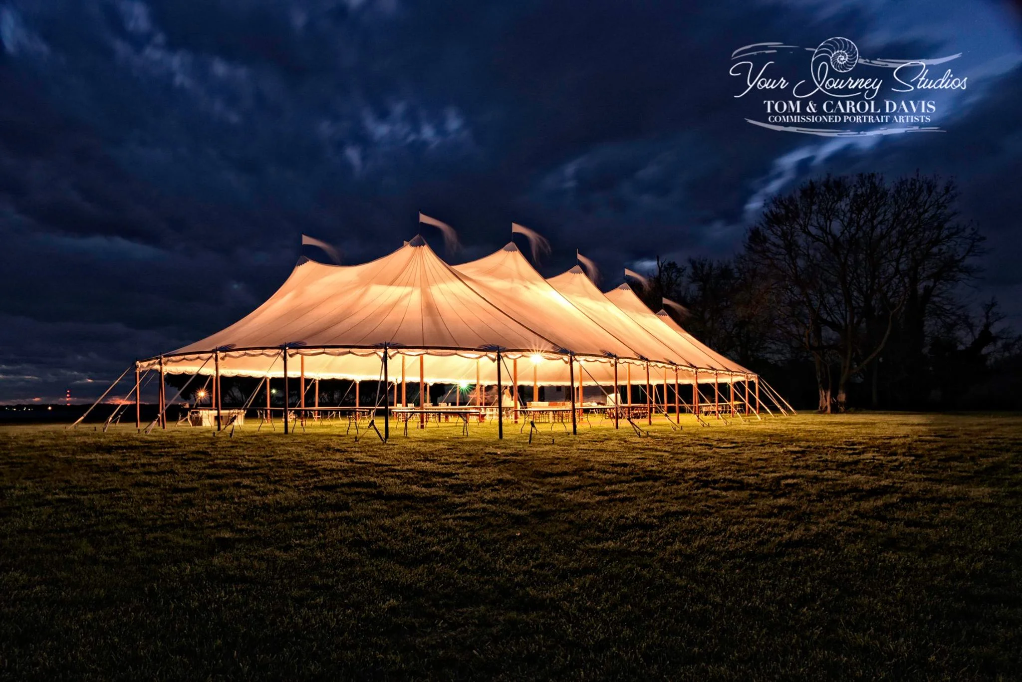 Big tent behind Talley at night